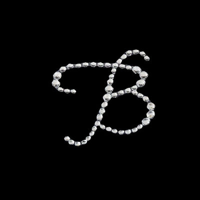 Rhinestone letter B design on a black background.