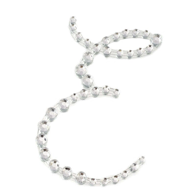 Crystal ribbon embellishment on white background