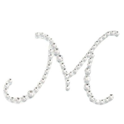 Crystal letter "M" decoration on a white background.