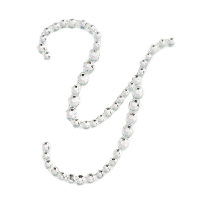 Silver beaded letter Y on a white background.