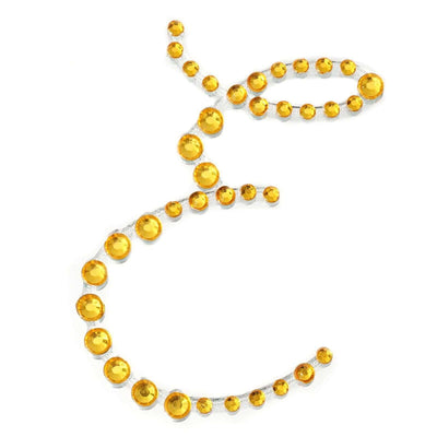 Yellow rhinestone embellishments arranged in a decorative pattern