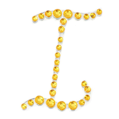Yellow rhinestone letter "J" decoration on white background.