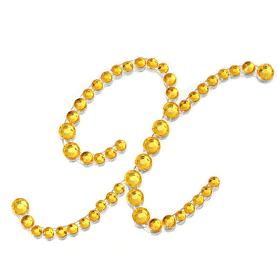 Yellow rhinestone embellishments arranged in a decorative pattern