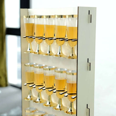 Elegant champagne flutes arranged in a stylish holder.