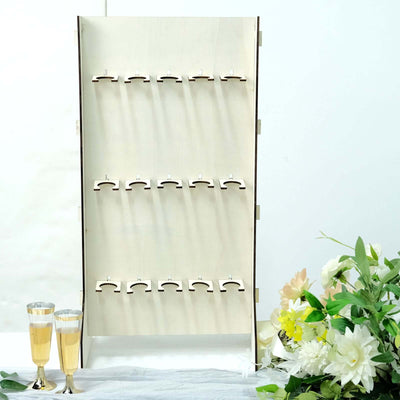 Wine rack display with glasses and decorative flowers