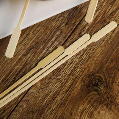 Bamboo skewers on a wooden surface