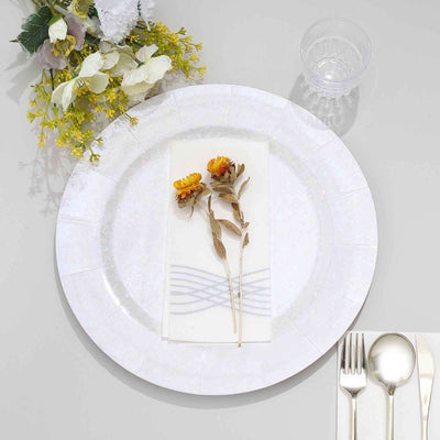 Elegant floral table setting with a decorative plate and utensils.