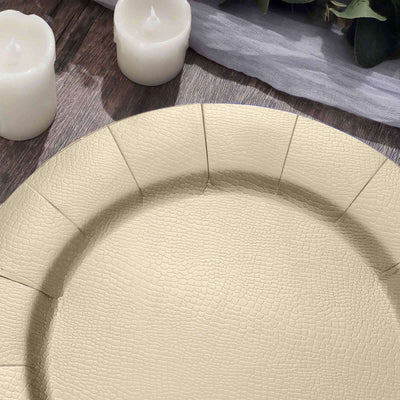 Beige textured serving platter on wooden table with candles.