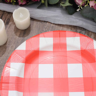 Red and white checkered disposable plate on a wooden table.
