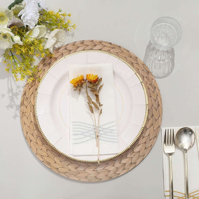 Elegant table setting with floral accents on a woven placemat.