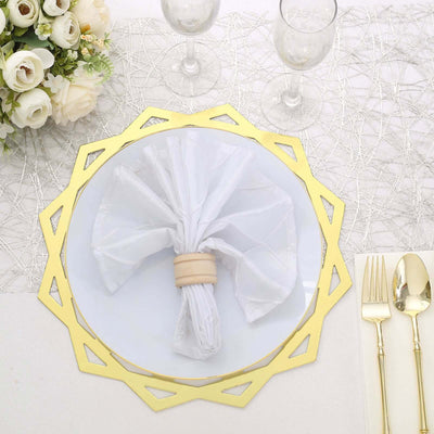 Gold decorative charger plate with white napkin and ring on elegant table setting.