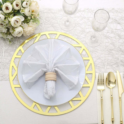 Elegant table setting with white napkin, gold placemat, and floral centerpiece.