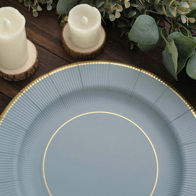 Elegant blue plate with gold rim on a rustic wooden table
