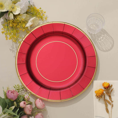 Red decorative plate with gold trim on a neutral background.