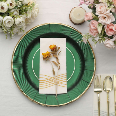Elegant green plate with floral napkin and decorative elements on a table setting.