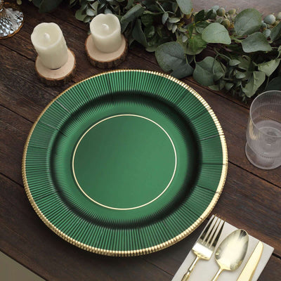Green decorative plate with gold rim on a wooden table setting.