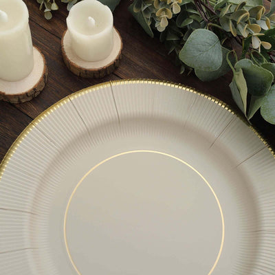 Elegant decorative plate with gold rim and ribbed design on rustic wood background.