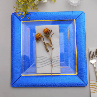 Blue decorative plate with white napkin and dried flowers, elegantly arranged.