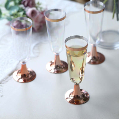 Elegant champagne flutes with rose gold bases and clear glass tops.