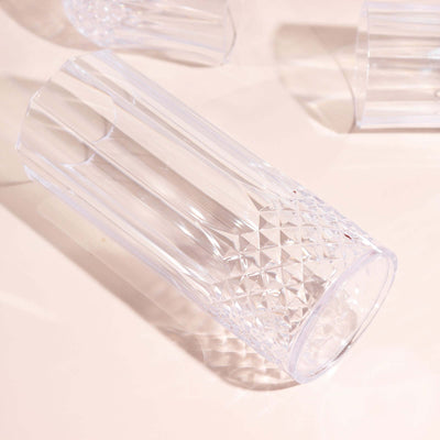 Clear crystal drinking glass with a diamond pattern design.