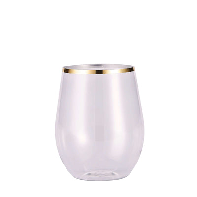 Clear glass tumbler with gold rim on a white background
