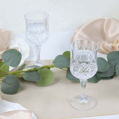 Elegant crystal wine glasses with intricate diamond patterns.