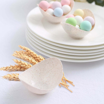Eco-friendly serving bowls with pastel decorative balls and wheat stalks.