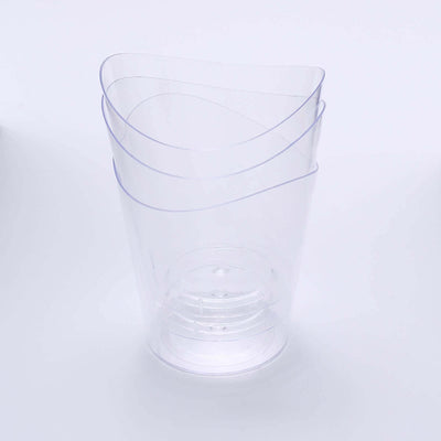 Clear stackable plastic cups for versatile use in dining and parties.