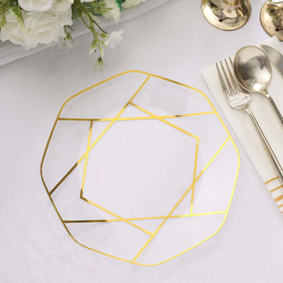Gold geometric serving plate on a white table setting.