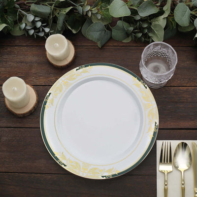Elegant white dinner plate with gold trim on a rustic wooden table setting.