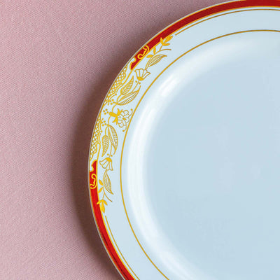 Decorative porcelain plate with a gold and red floral border.