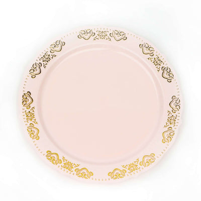 Pink decorative plate with gold floral design on the rim