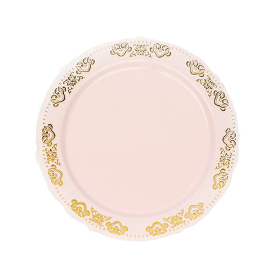 Elegant pink plate with gold ornate design, perfect for dining.
