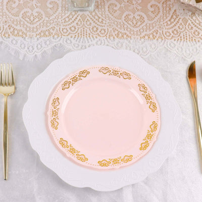 Elegant pink plate with gold trim on a lace table setting.
