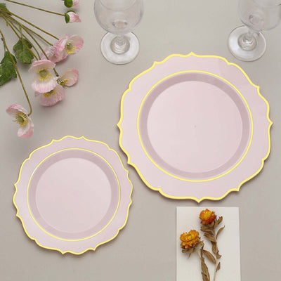 Pink decorative plates with gold trim on a neutral background.