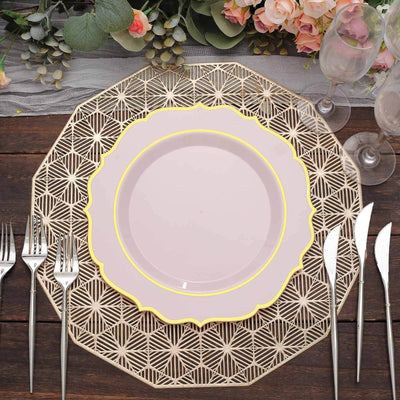Elegant pink plate with gold rim on decorative lace charger, set for dining.
