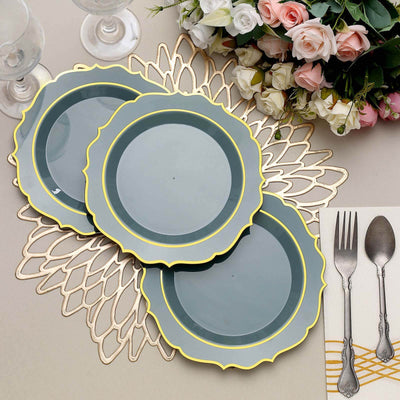 Three decorative plates with yellow edges on a stylish table setting.