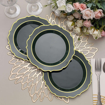 Elegant green plates with gold trim, arranged on a decorative placemat.