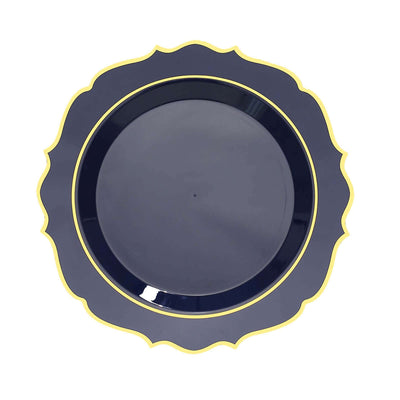 Navy blue plate with scalloped edges and gold trim on a white background