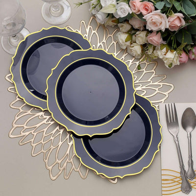 Elegant navy blue plates with gold trim arranged on a decorative table setting.