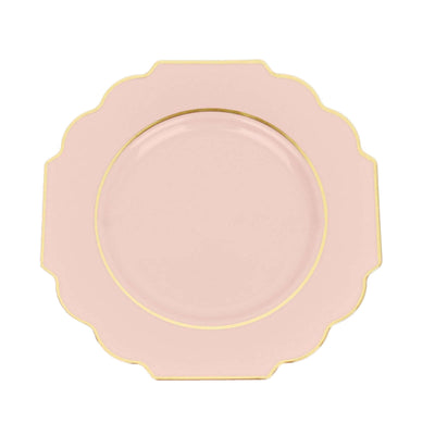 Pink scalloped plate with gold trim on white background
