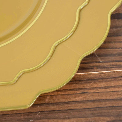 Yellow decorative plate with scalloped edges on a wooden surface.