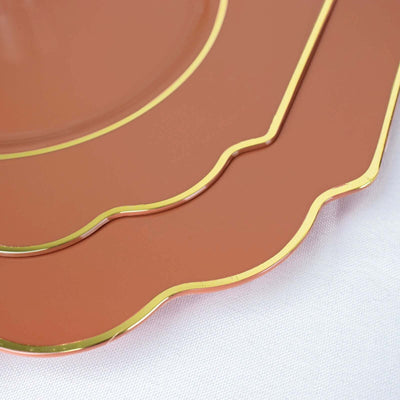 Elegant copper plates with gold trim in a stacked arrangement.