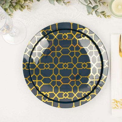 Decorative navy plate with gold geometric pattern on a table setting.