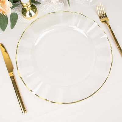 Clear glass plate with a gold rim, elegantly set on a table.