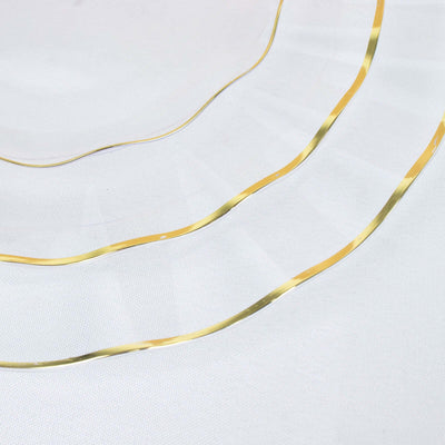 Gold wavy metal strips on a plain white background