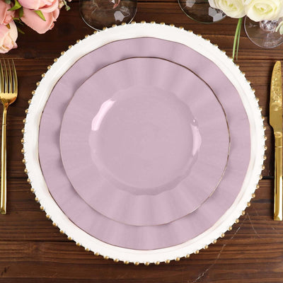 Elegant purple plates layered on a decorative table setting.