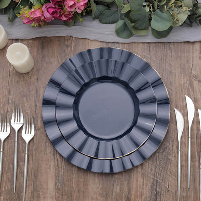 Elegant navy blue dinner plates with gold trim on a rustic wooden table setting.