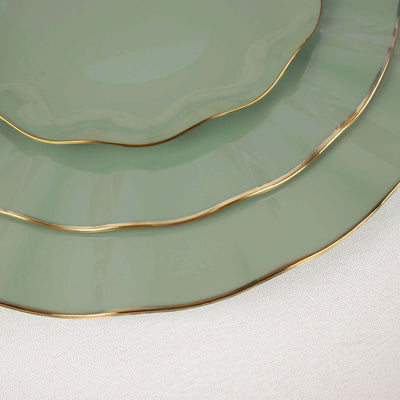 Elegant green plates with gold rims, stacked in a decorative arrangement.