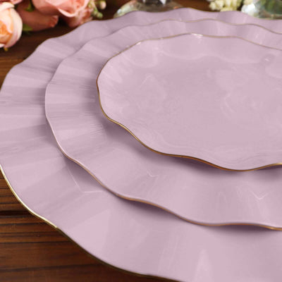 Elegant lavender plates with gold trim in a stacked arrangement.